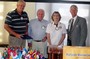 Paul Harris Fellow presentation to Kris Kristensen and Don Huff, Jr, by President Dona Mast and DG Dave Dacus
